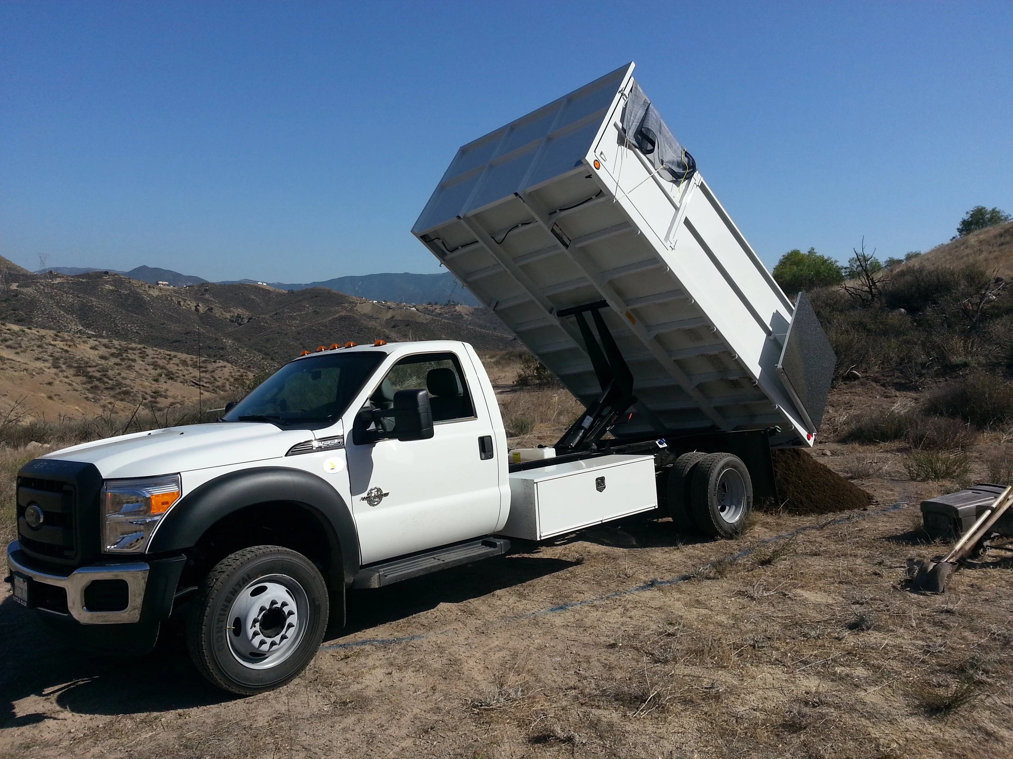 F-550 dump truck dumping load